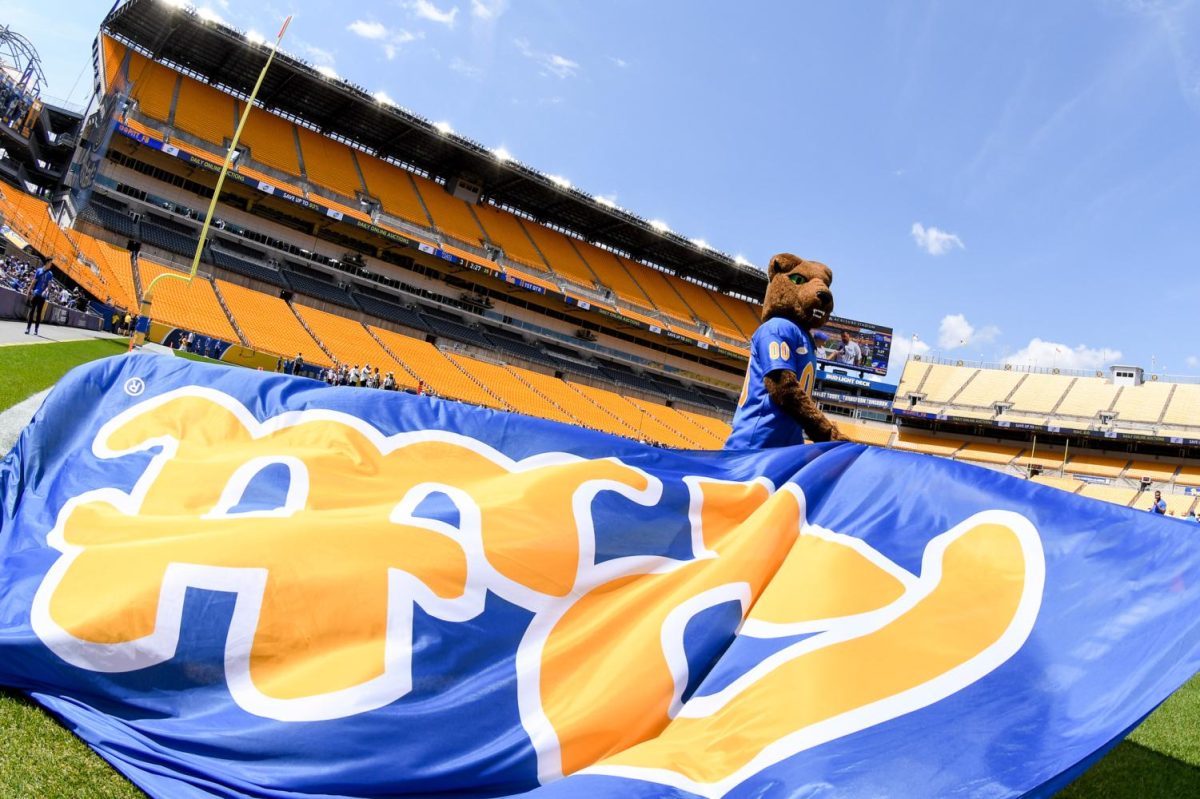Roc the Panther waves a flag at the Pitt football spring game on April 15 at Acrisure Stadium.
