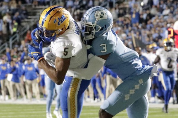 Pittsburgh wide receiver Jared Wayne (5), left, hauls in a long pass against North Carolina defensive back Storm Duck (3) to set up a touchdown during a game in Chapel Hill, North Carolina on Saturday, Oct. 29, 2022.