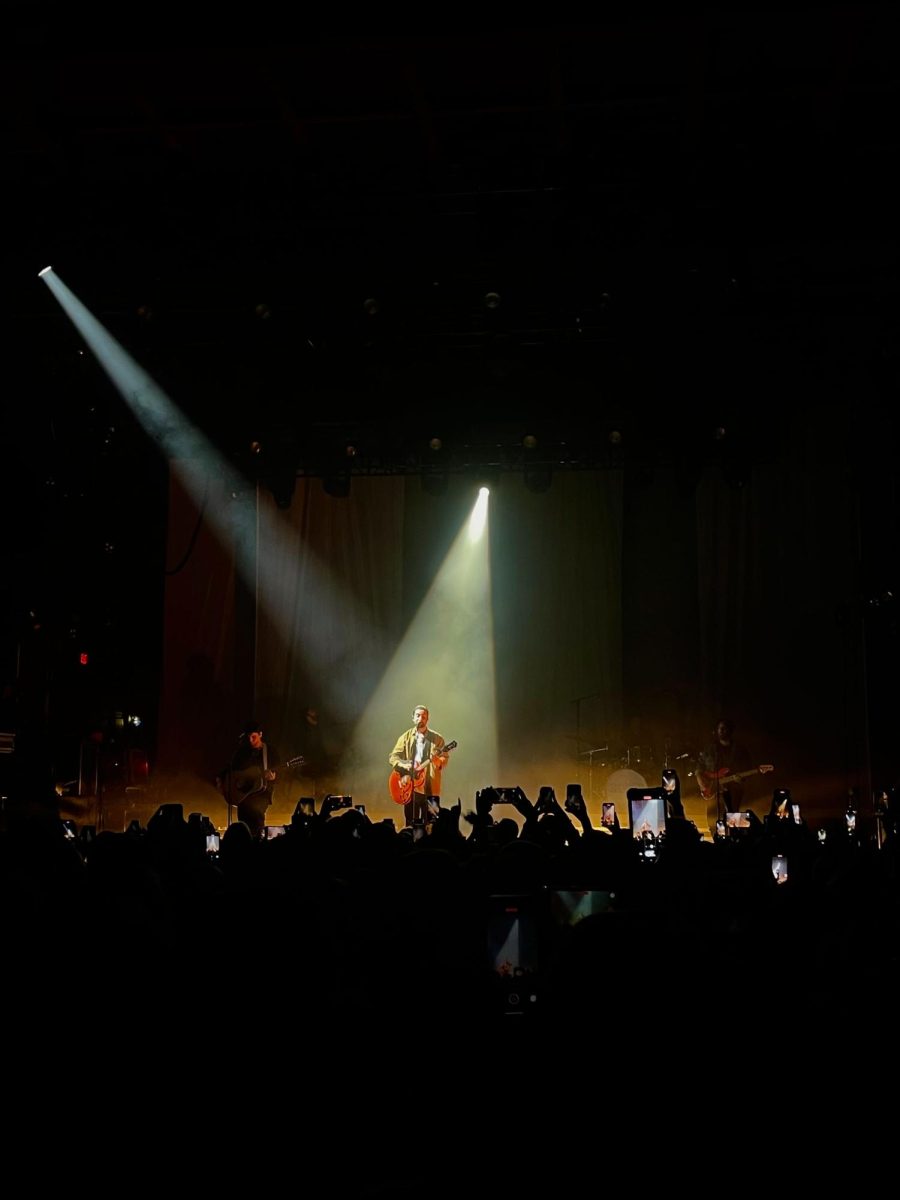 Noah Kahan performs on stage during his Stick Season tour.