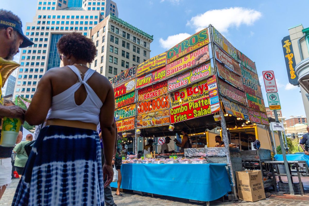 Festivalgoers stand near a food stand at Pittsburghs Soul Food Festival this past weekend in Market Square.