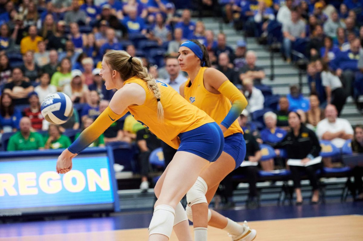 Pitt graduate student middle blocker Emma Monks (9) bumps the ball during a game against Oregon on Sep. 24, 2023 in the Fitzgerald Field House.
