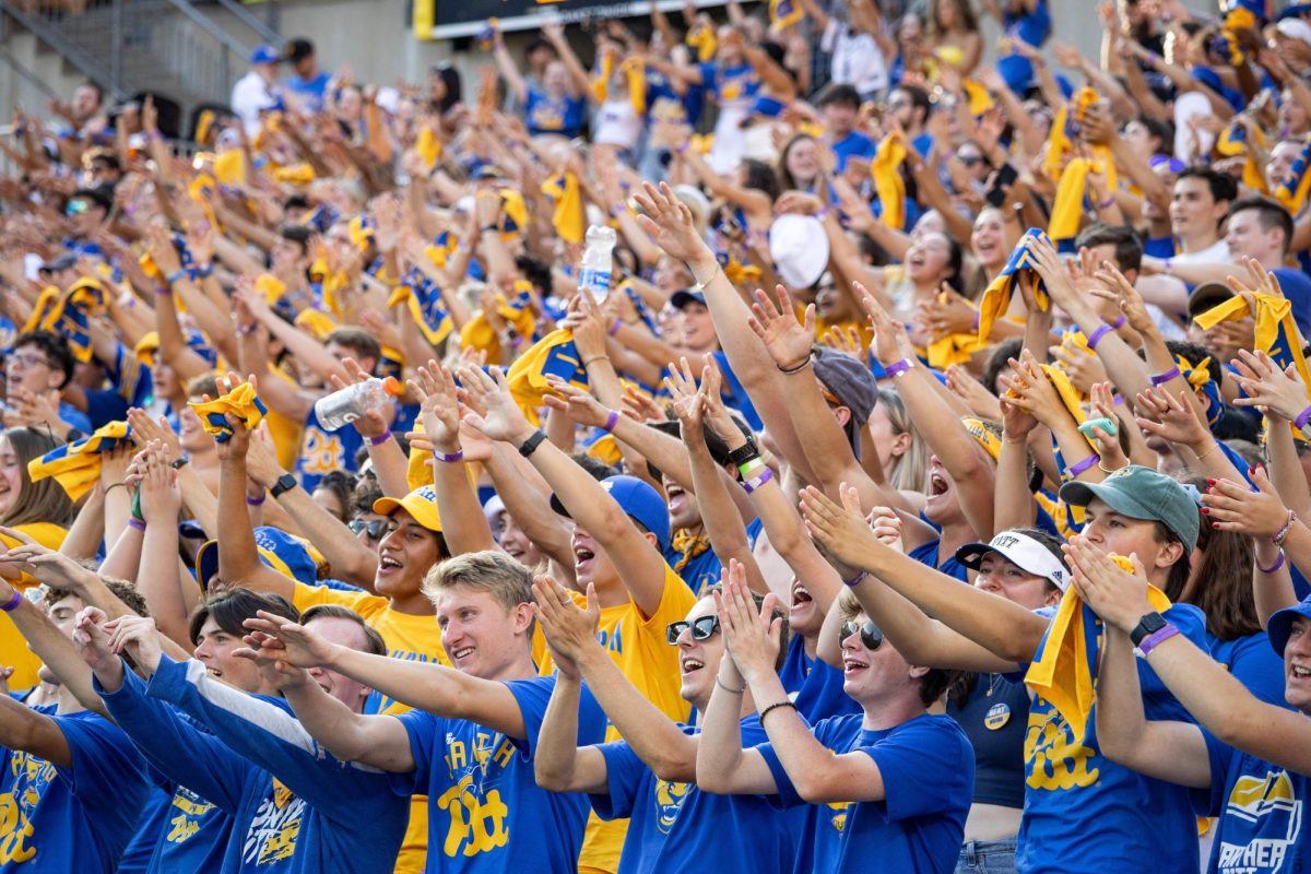 Pitt football fans cheer during the first game of the season against Wofford at Acrisure Stadium on Saturday afternoon. 