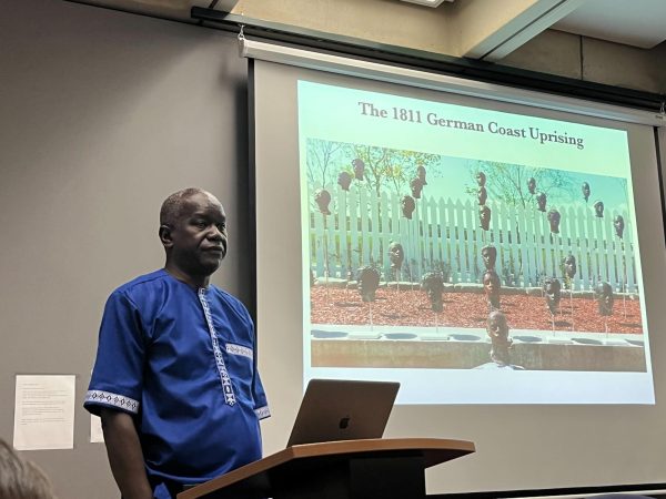 Prof. Ibrahima Seck gives a lecture titled “A journey through slavery at the Whitney Plantation” in the history lounge on the third floor in Posvar on Tuesday.