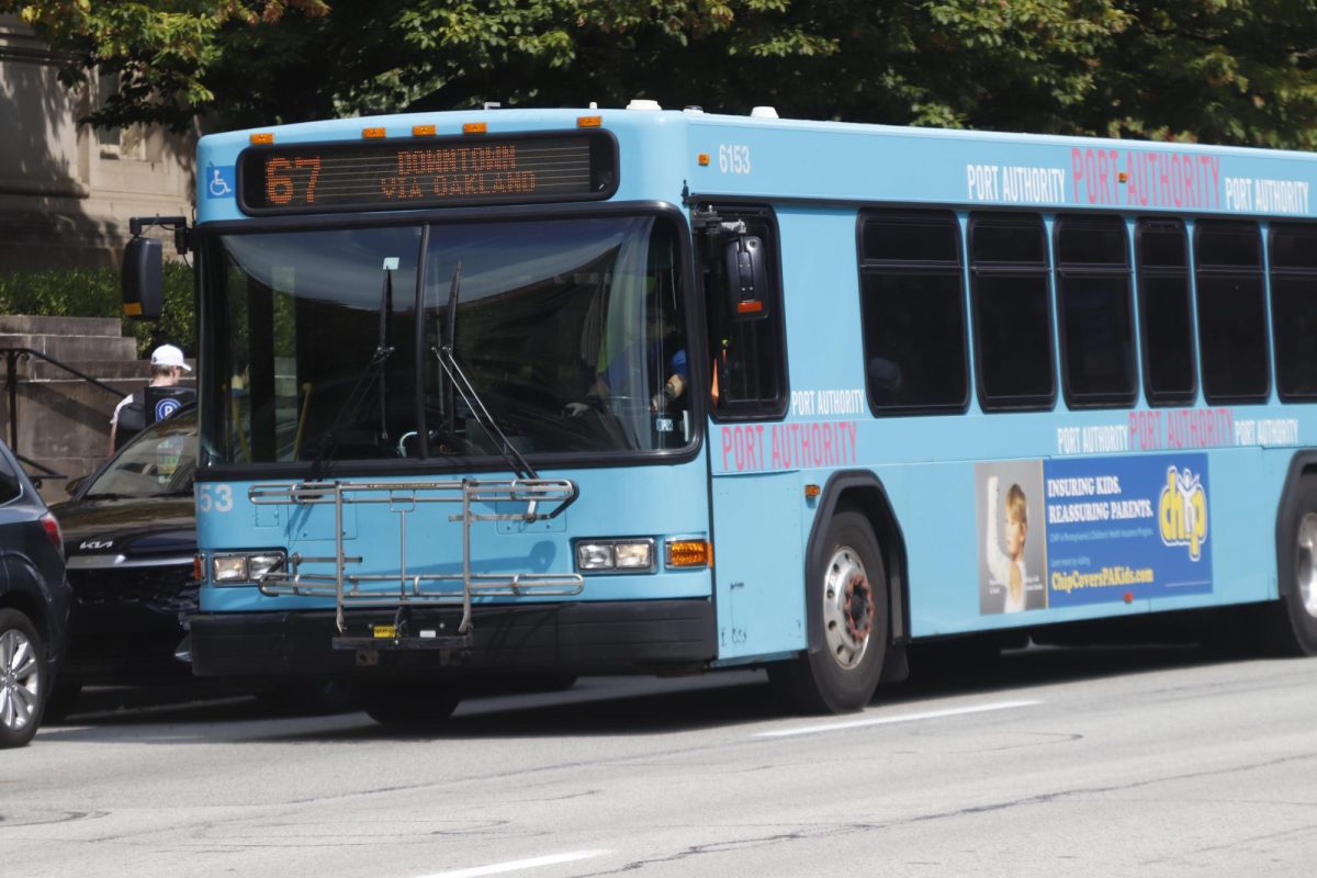 A+Pittsburgh+Regional+Transit+bus+drives+through+Oakland+on+Sept.+12%2C+2023.