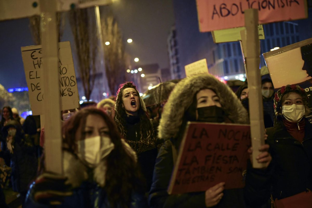 A woman shouts slogans while protesting male violence against women in Pamplona, northern Spain, Thursday Nov. 25, 2021, during the International Day for the elimination of violence against women.