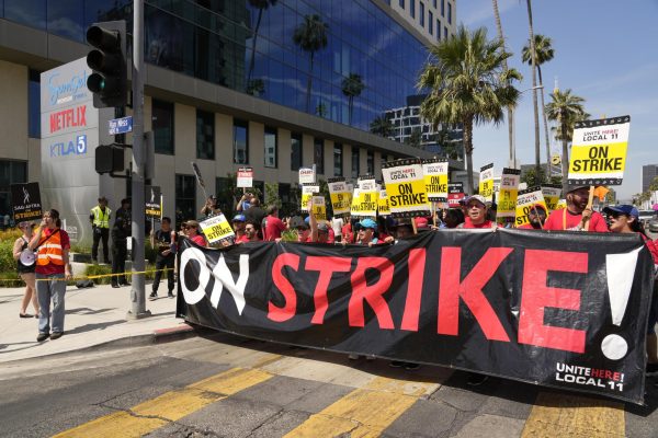 Striking Hotel workers from Unite Here Local 11 join the picketing actors of SAG-AFTRA, and writers of the WGA, outside Netflix studios, July 21, 2023, in Los Angeles.