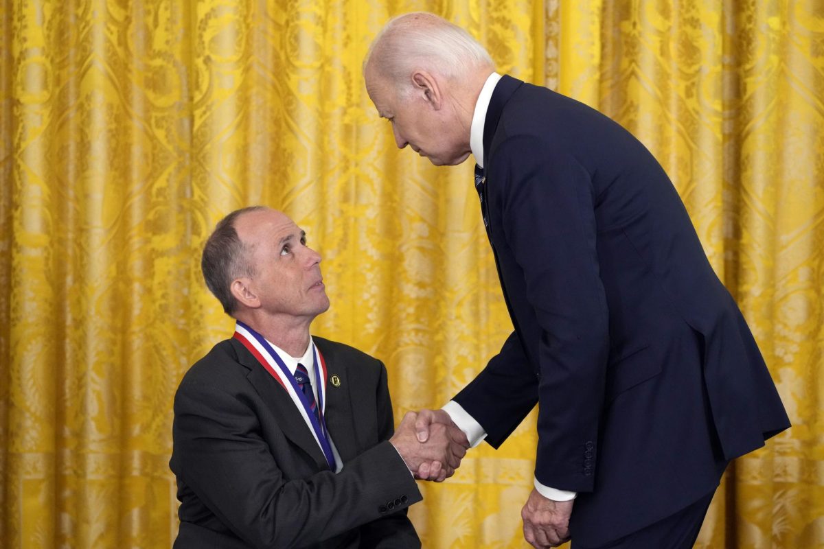 President Joe Biden awards the National Medal of Technology and Innovation to Rory Cooper in the East Room of the White House, Tuesday Oct. 24, in Washington.