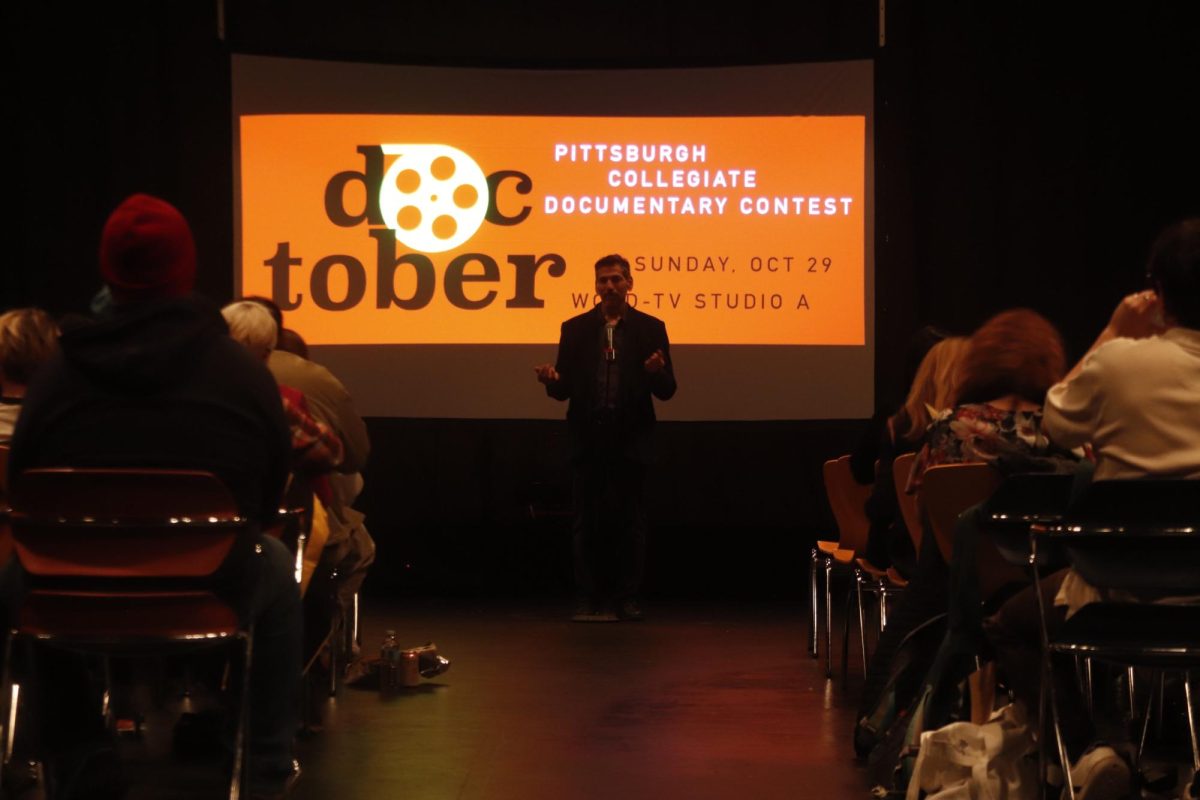 Will Zavala, a visiting lecturer in the film and media studies program at Pitt, addresses the audience during DOCTOBER, a collegiate film contest, at WQED Studio A on Sunday, Sept. 29.