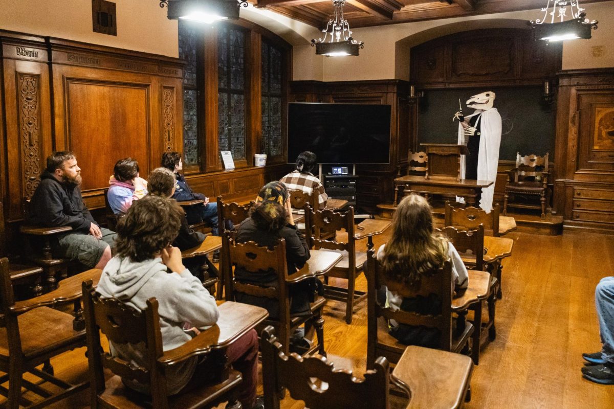 A member of Quo Vadis provides historical details during a guided tour in the German Nationality Room on Oct. 23.