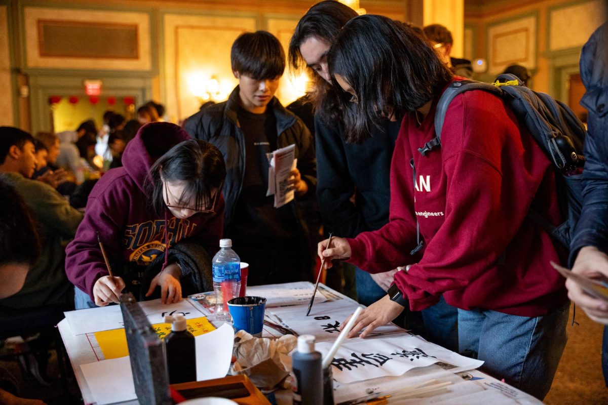 Students learn calligraphy techniques during Sunday’s JSA Bunkasai event in the William Pitt Union.