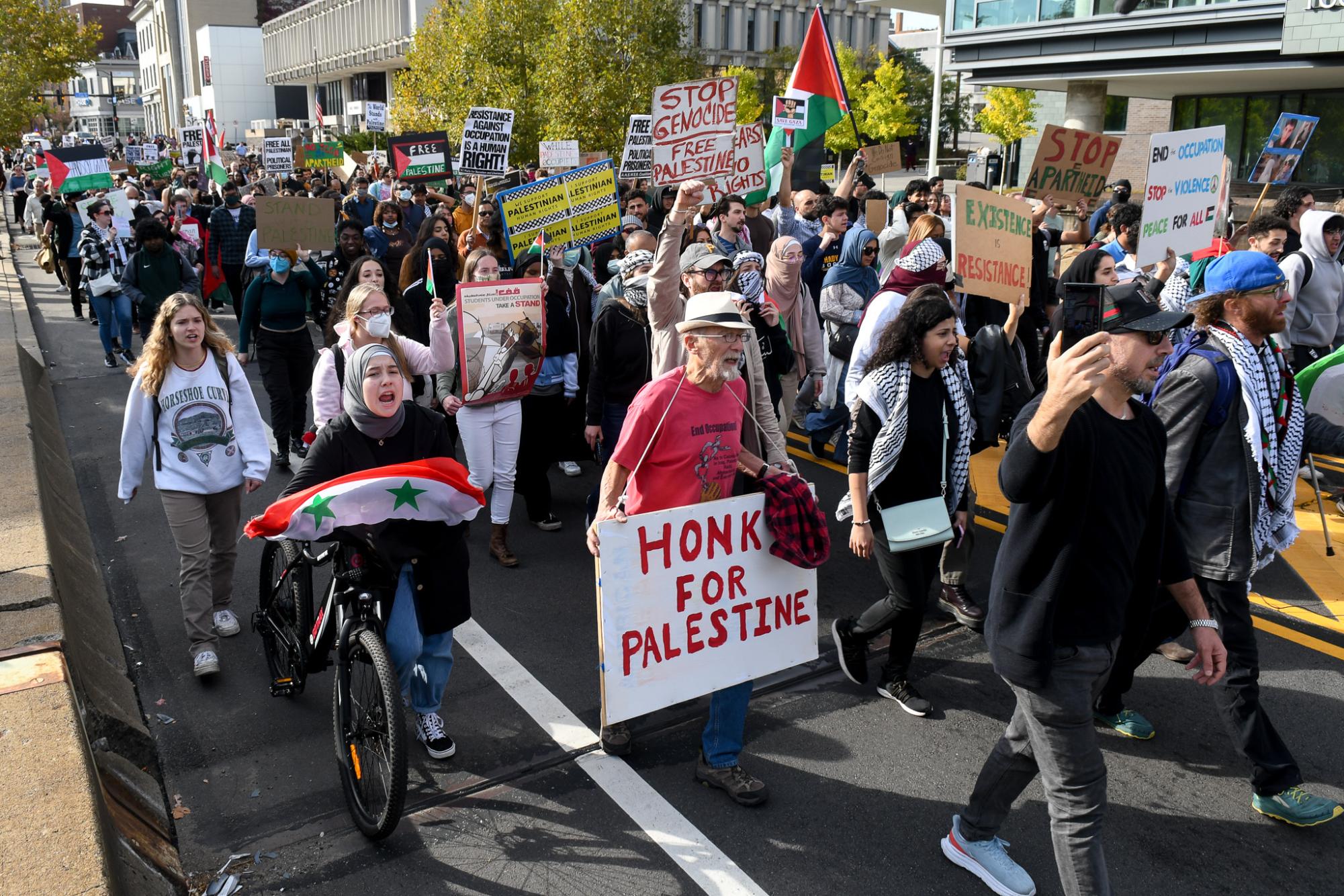 People chant in a rally in support of Palestine passes through Carnegie Mellon University Friday afternoon. 