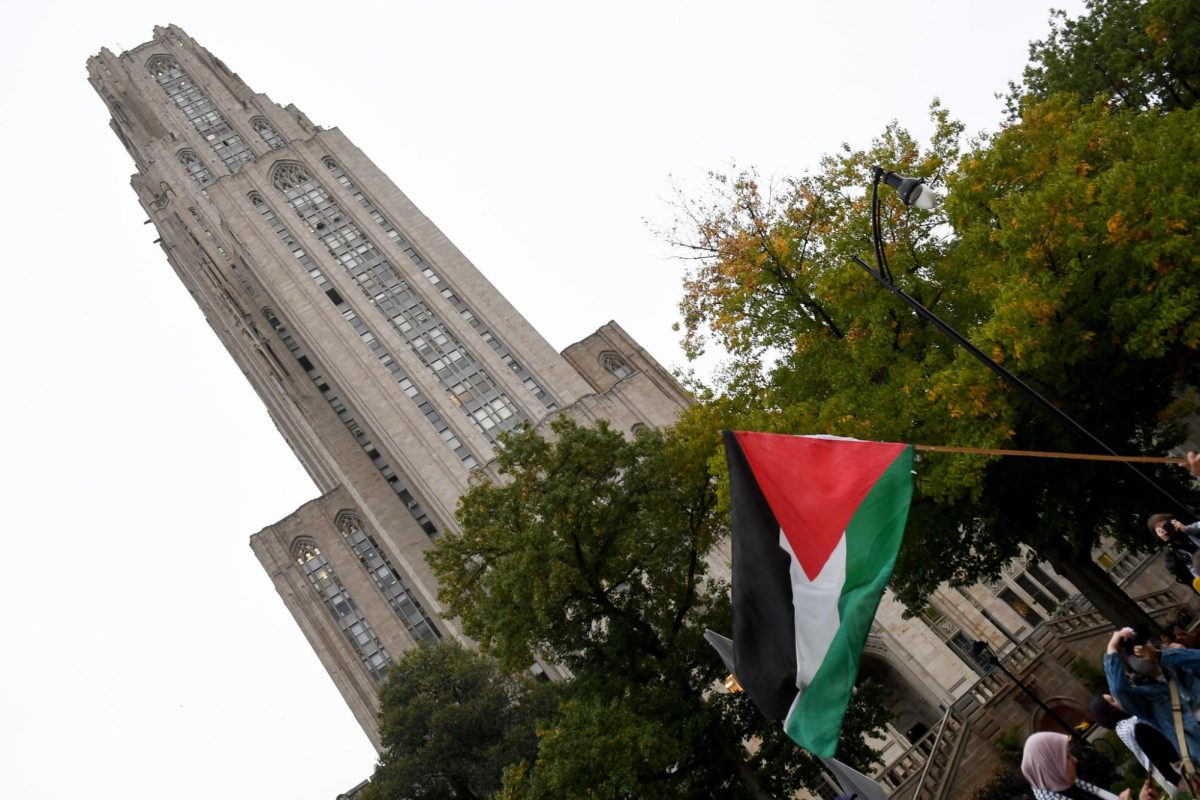 A Palestinian flag in front of the Cathedral of Learning in a rally in support of Palestine on Thursday afternoon. 