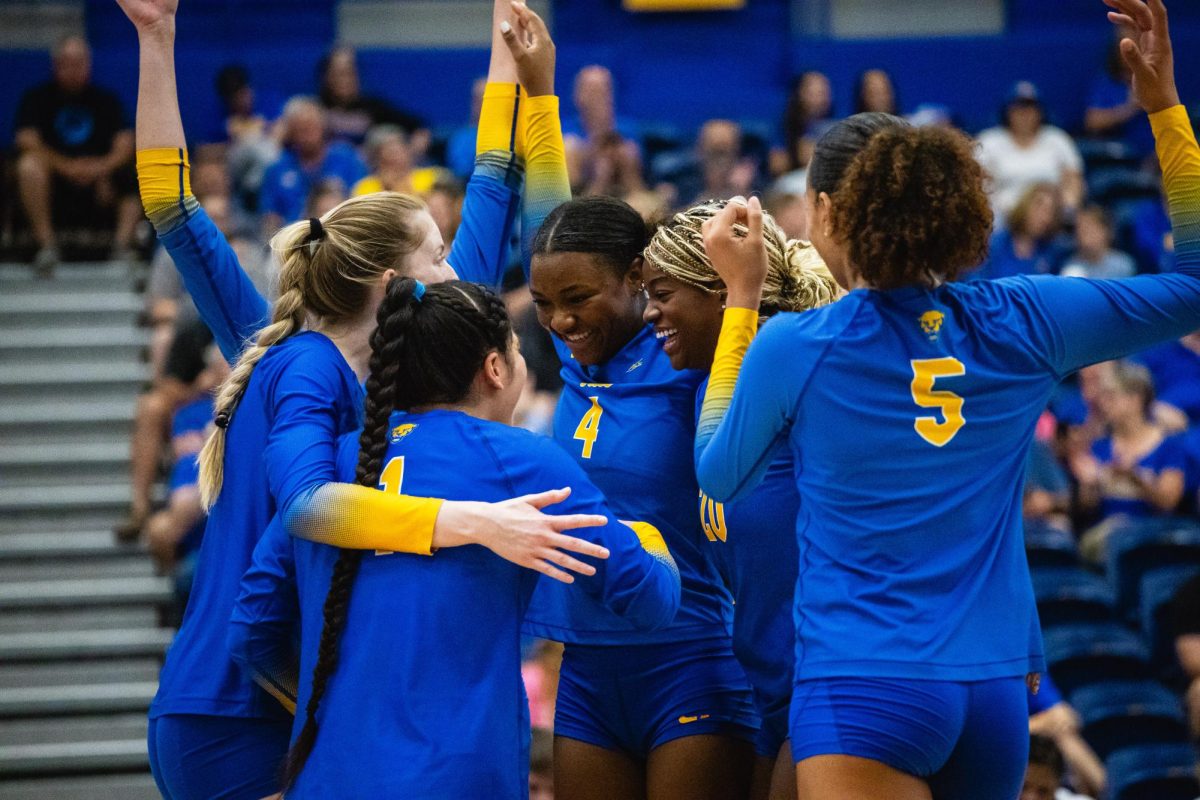 Pitt’s volleyball team celebrates a point against Syracuse in the Fitzgerald Field House on Oct. 1, 2023.