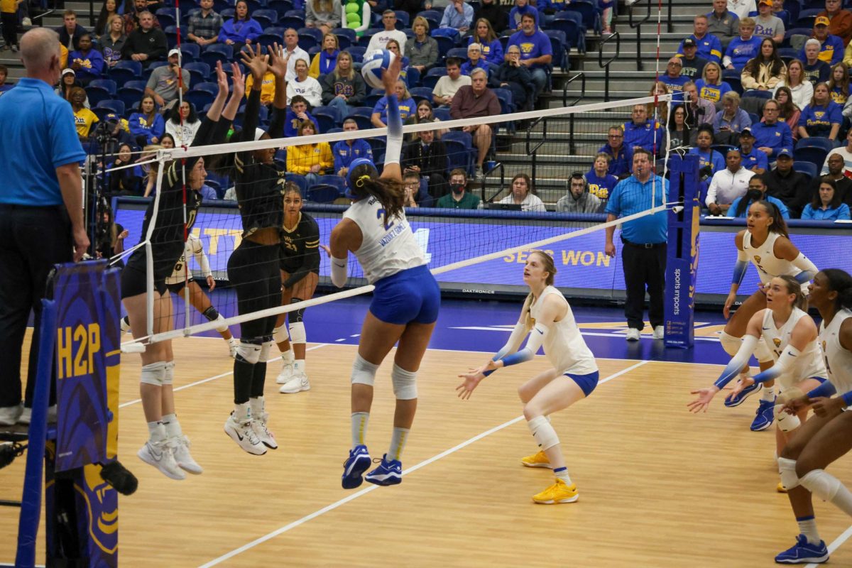 Redshirt Senior outside hitter Valeria Vazquez Gomez (2) blocks the ball during the game against Wake Forest in the Fitzgerald Field House on Sunday.