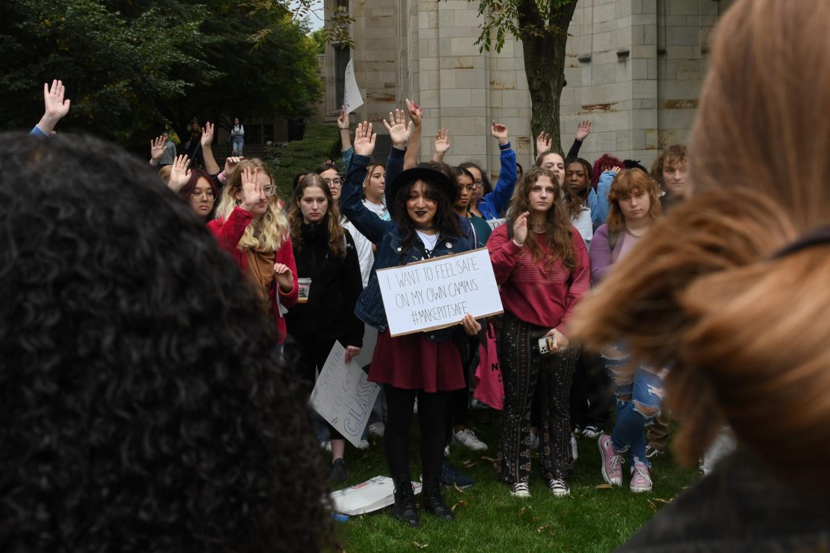 Protesters gather outside the Cathedral of Learning in response to sexual violence on campus on Oct. 7, 2022.