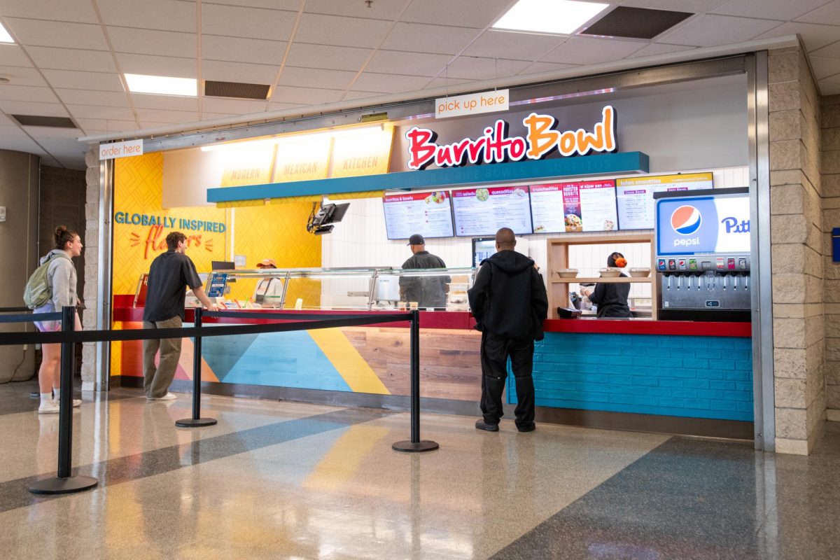 Customers order at Burrito Bowl in the Petersen Events Center.