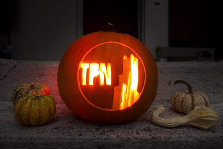 The Pitt News logo carved on a pumpkin.