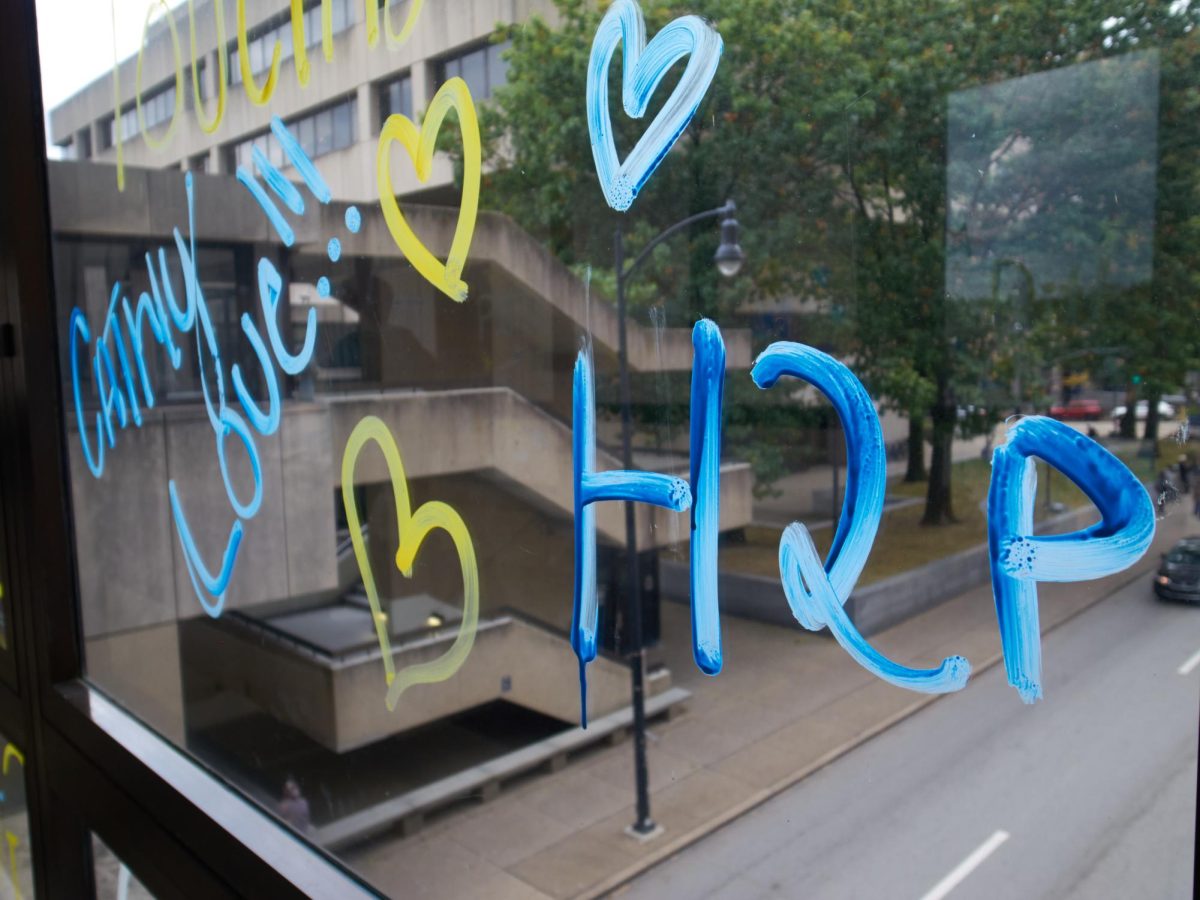 Window painting decorates the pedestrian bridge over Forbes Ave in celebration of Homecoming 2023. 