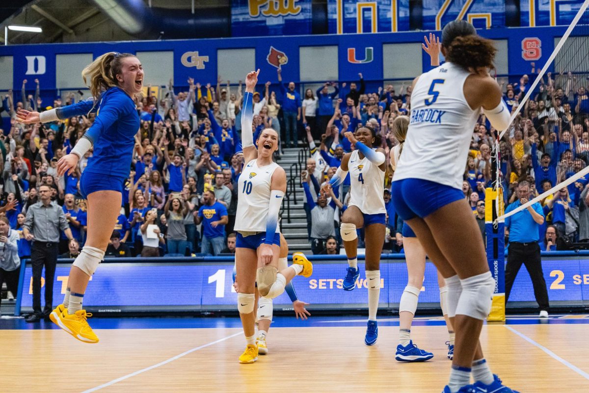 Junior Rachel Fairbanks (10) celebrates with teammates after winning against Georgia Tech on Friday at the Fitzgerald Field House. 