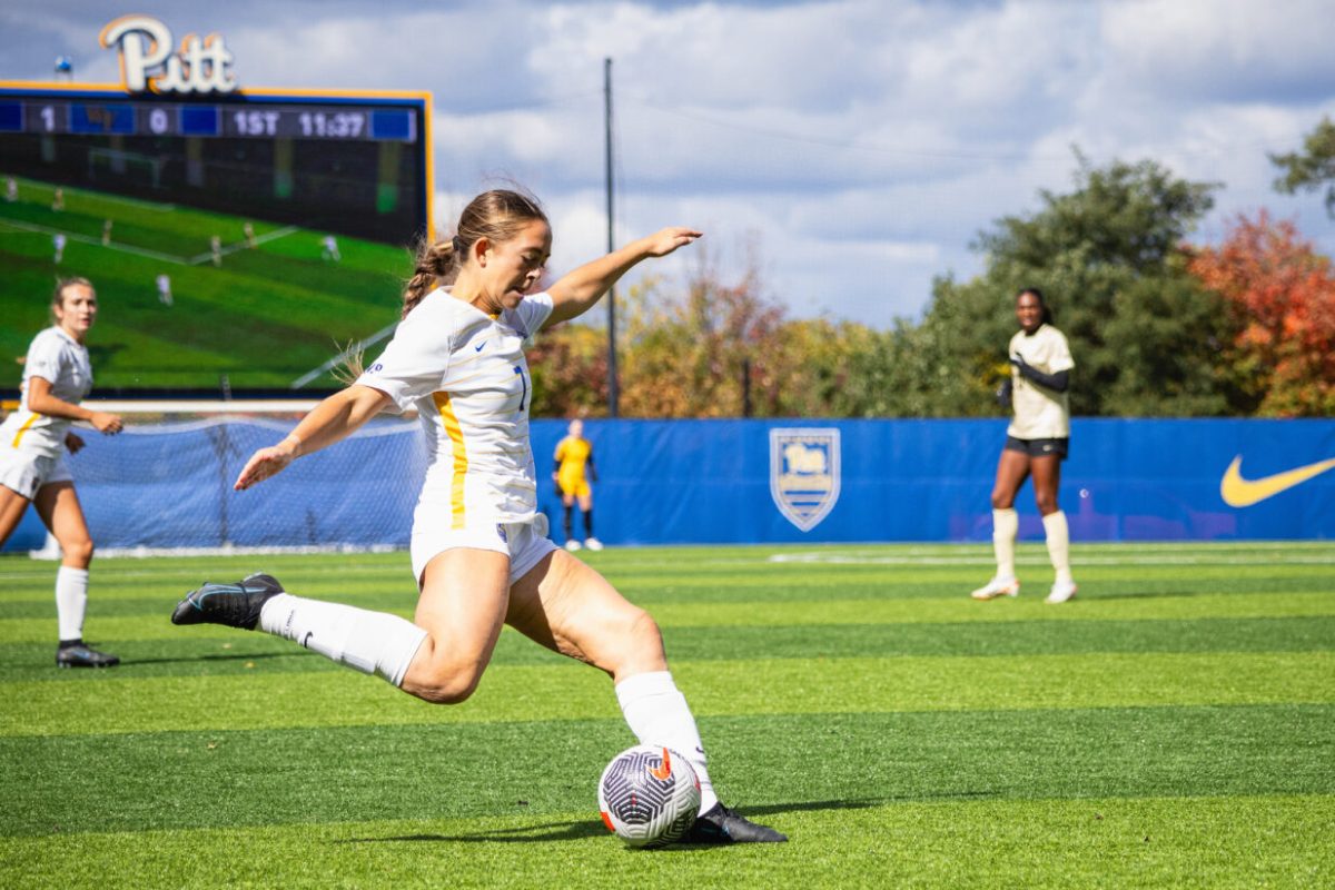 Sophomore midfielder Fleming Dean (7) kicks the ball during the game against Wake Forest at Ambrose Urbanic Field on Sunday. 