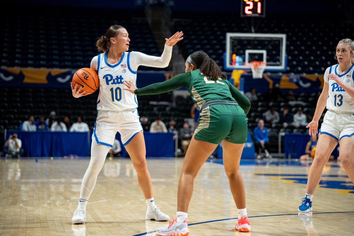 Junior guard Bella Perkins (10) gets ready to make a pass during Monday night’s exhibition game against Point Park in the Petersen Events Center.