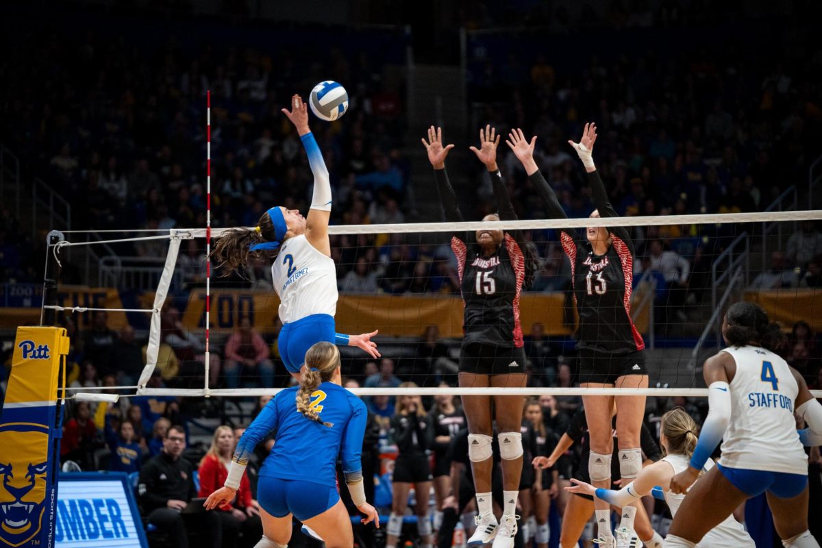 Redshirt senior outside hitter Valeria Vazquez Gomez (2) spikes the ball during Saturday afternoons match against Louisville at the Petersen Events Center.