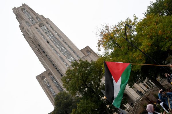 A Palestinian flag in front of the Cathedral of Learning at a rally in support of Palestine on Oct. 19. 