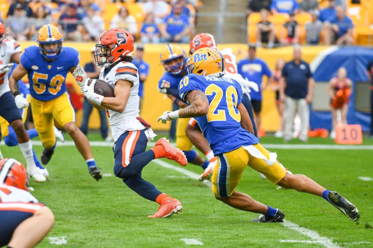 Redshirt freshman defensive back Javon McIntyre (20) attempts to tackle a Syracuse player during Pitt football’s game against Syracuse on Nov. 5, 2022.
