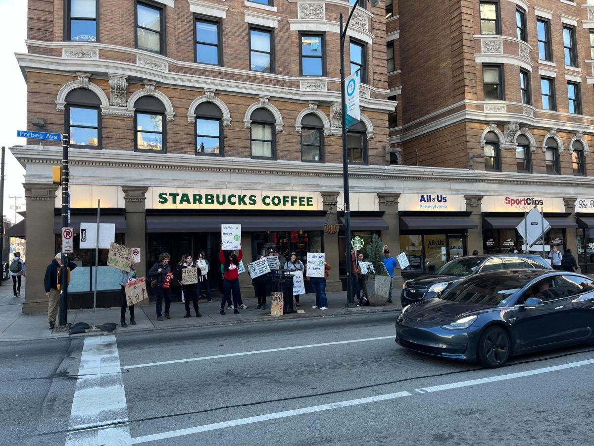 Starbucks workers strike during Red Cup Day on Forbes Avenue on Thursday.