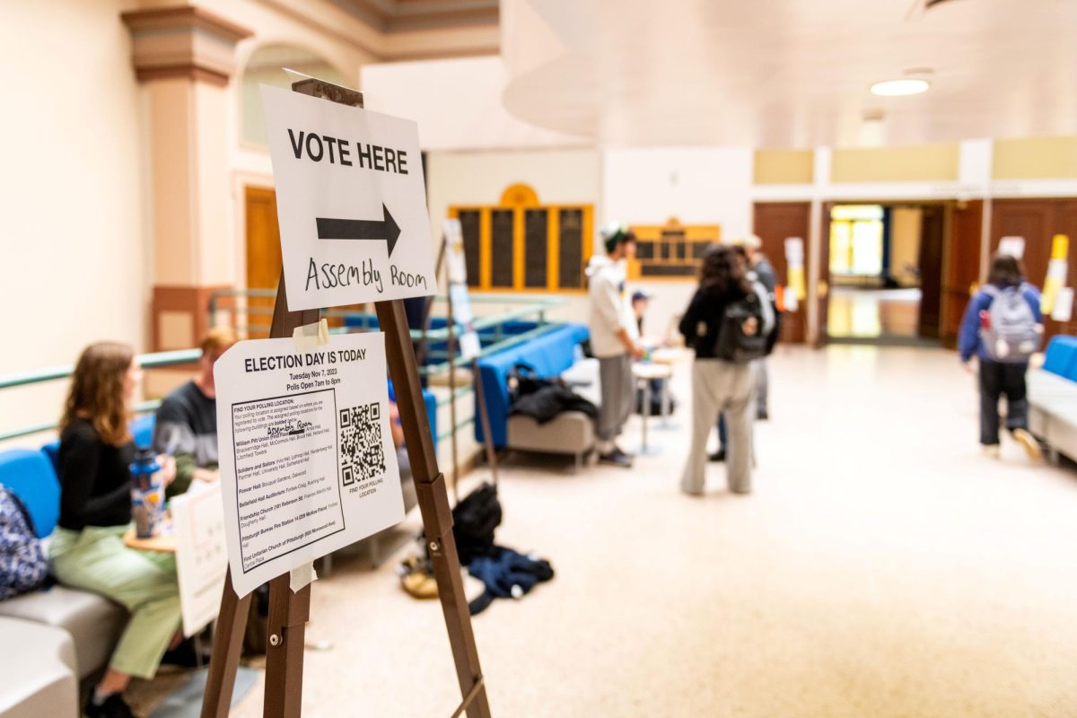 Signs direct voters to the polling station inside the William Pitt Union on Tuesday morning. 