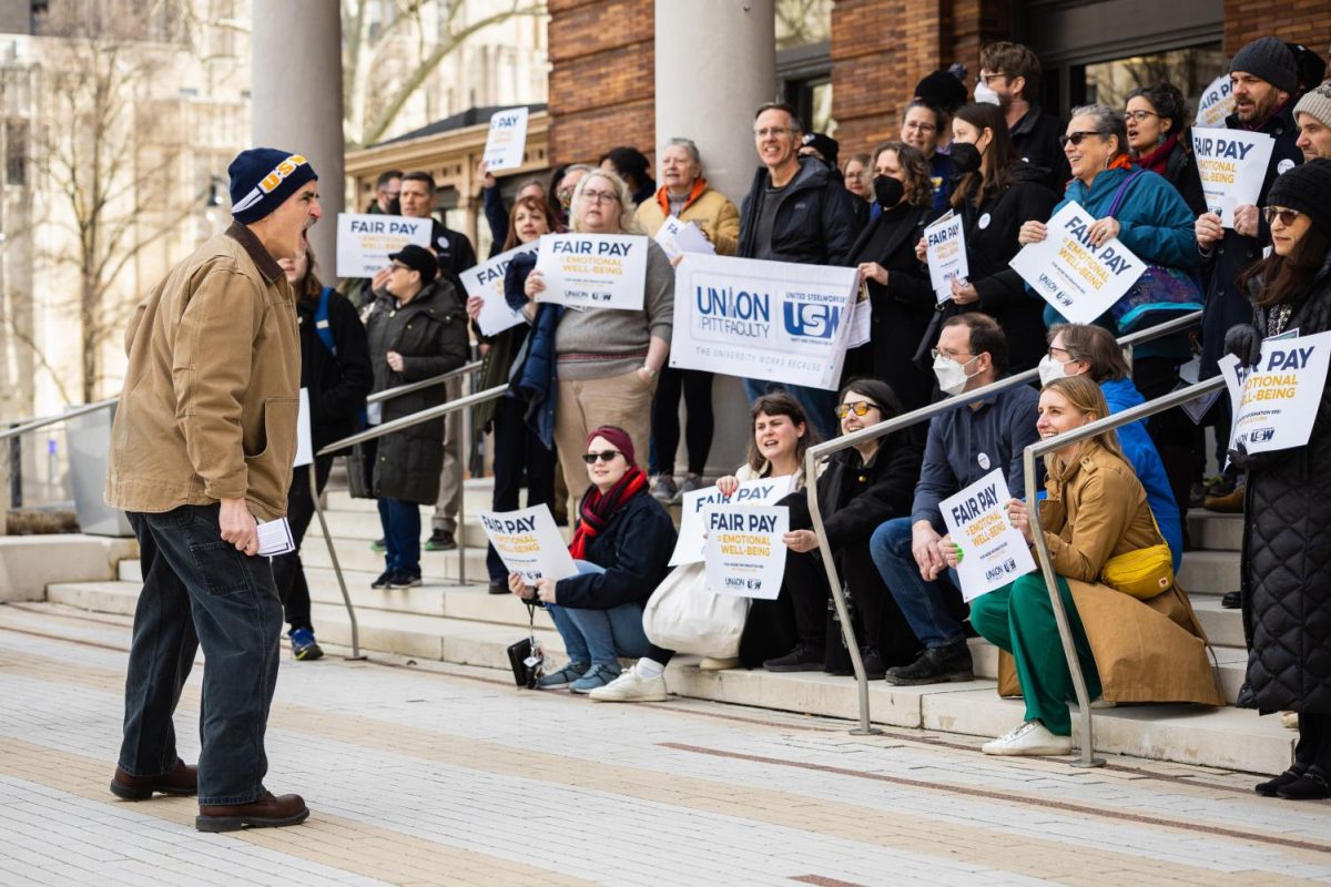 Supporters of the faculty union gather outside of the William Pitt Union on Friday, Feb. 24.