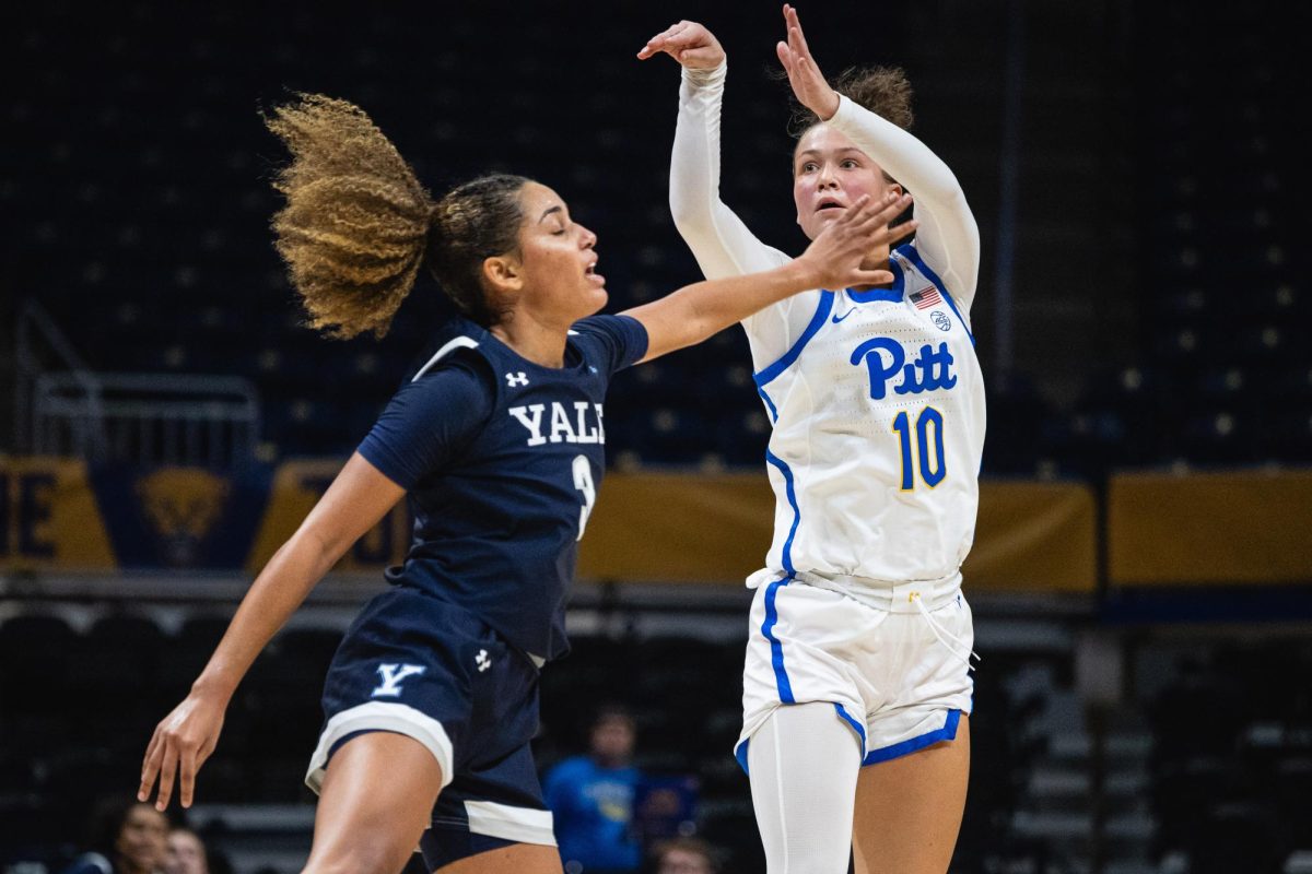 Junior guard Bella Perkins (10) shoots the three pointer to guarantee the win during Tuesday night’s game against Yale in the Petersen Events Center. 