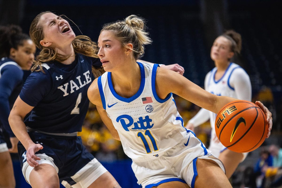 Sophomore guard Marley Washenitz (11) breaks past a defender during Tuesday night’s game against Yale in the Petersen Events Center.