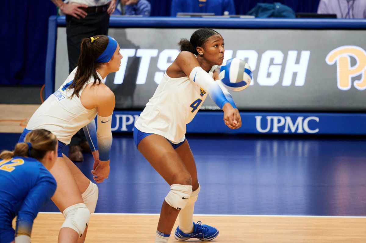 First-year outside hitter Torrey Stafford (4) receives a ball during Friday night’s match against Coppin State in the first round of the 2023 NCAA Tournament at the Petersen Events Center. 