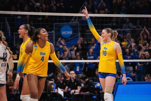 Junior setter Rachel Fairbanks (10) celebrates after a point during Saturday night’s match against USC in the second round of the 2023 NCAA Tournament at the Petersen Events Center.