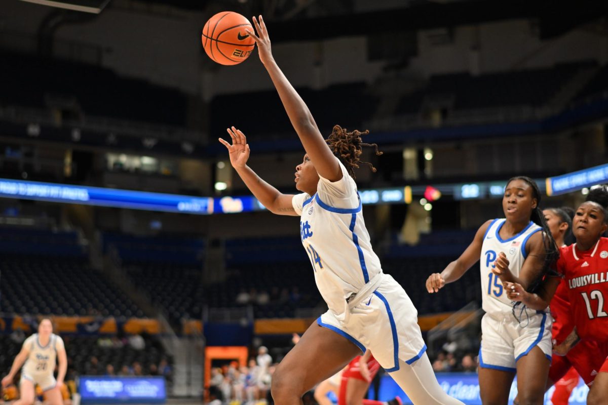 Graduate student forward Jala Jordan (14) reaches for a rebound during Thursday evening’s game against the Louisville Cardinals at the Petersen Events Center.