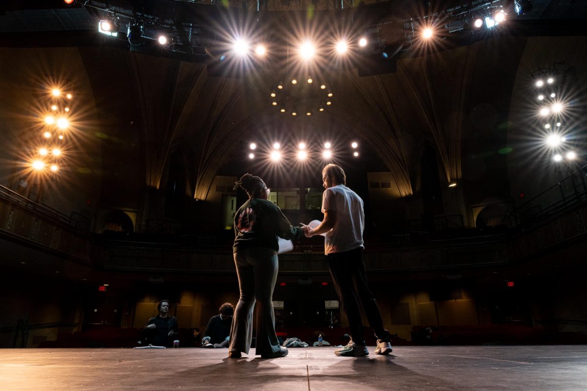 Austin James (Troy Bolton) and TyMariya Moss (Gabriella Montez) rehearse a scene in Randall Theatre on Saturday morning.
