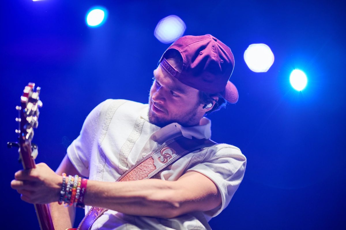 Conner Smith plays guitar during his performance at Stage AE on Friday night.