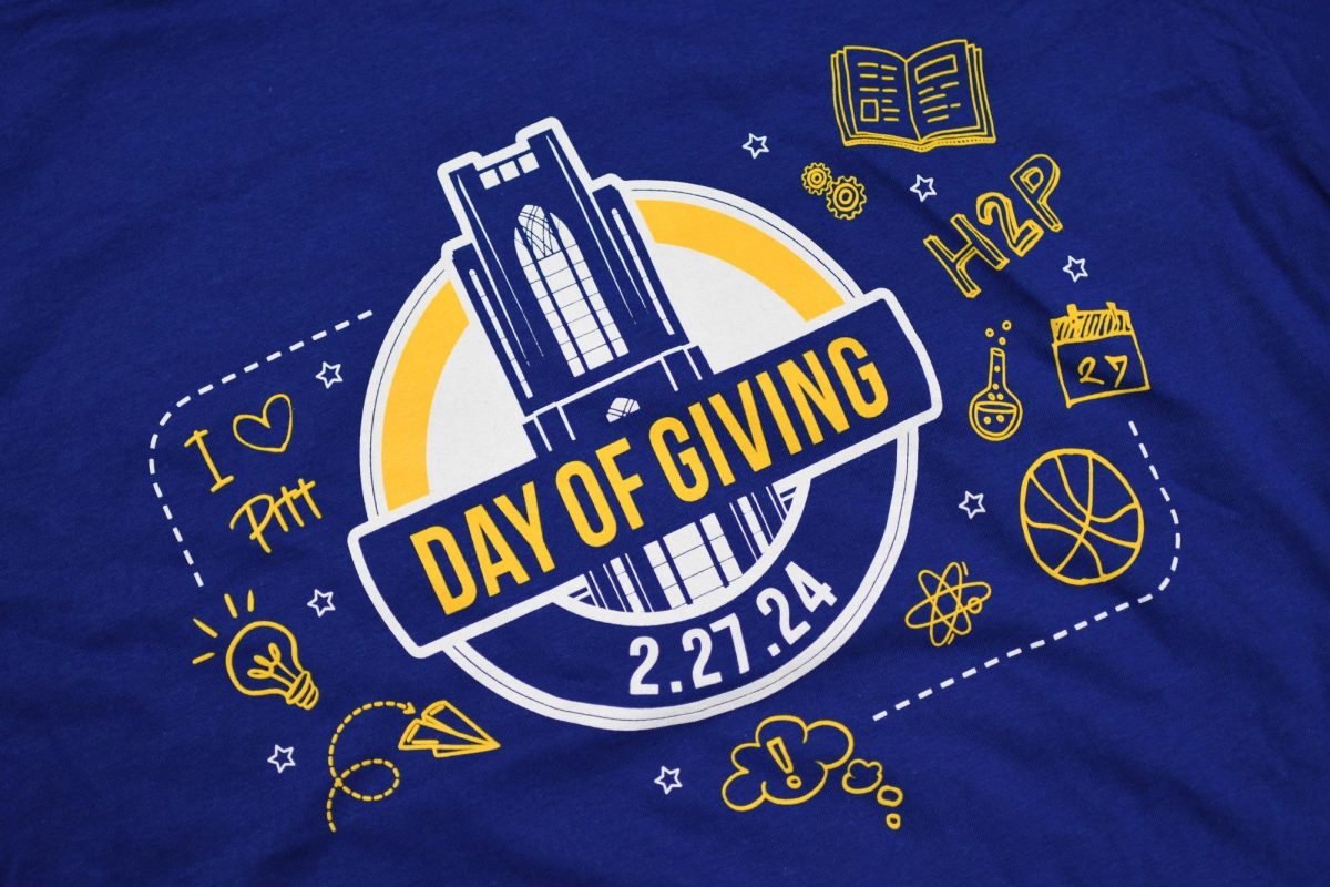 A T-shirt displays the logo for the 2024 Pitt Day of Giving.
