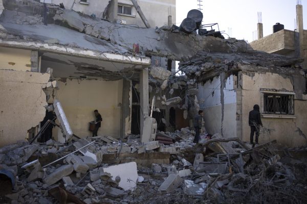 Palestinians check destruction after an Israeli strike in Rafah, Gaza Strip, on Feb. 21.