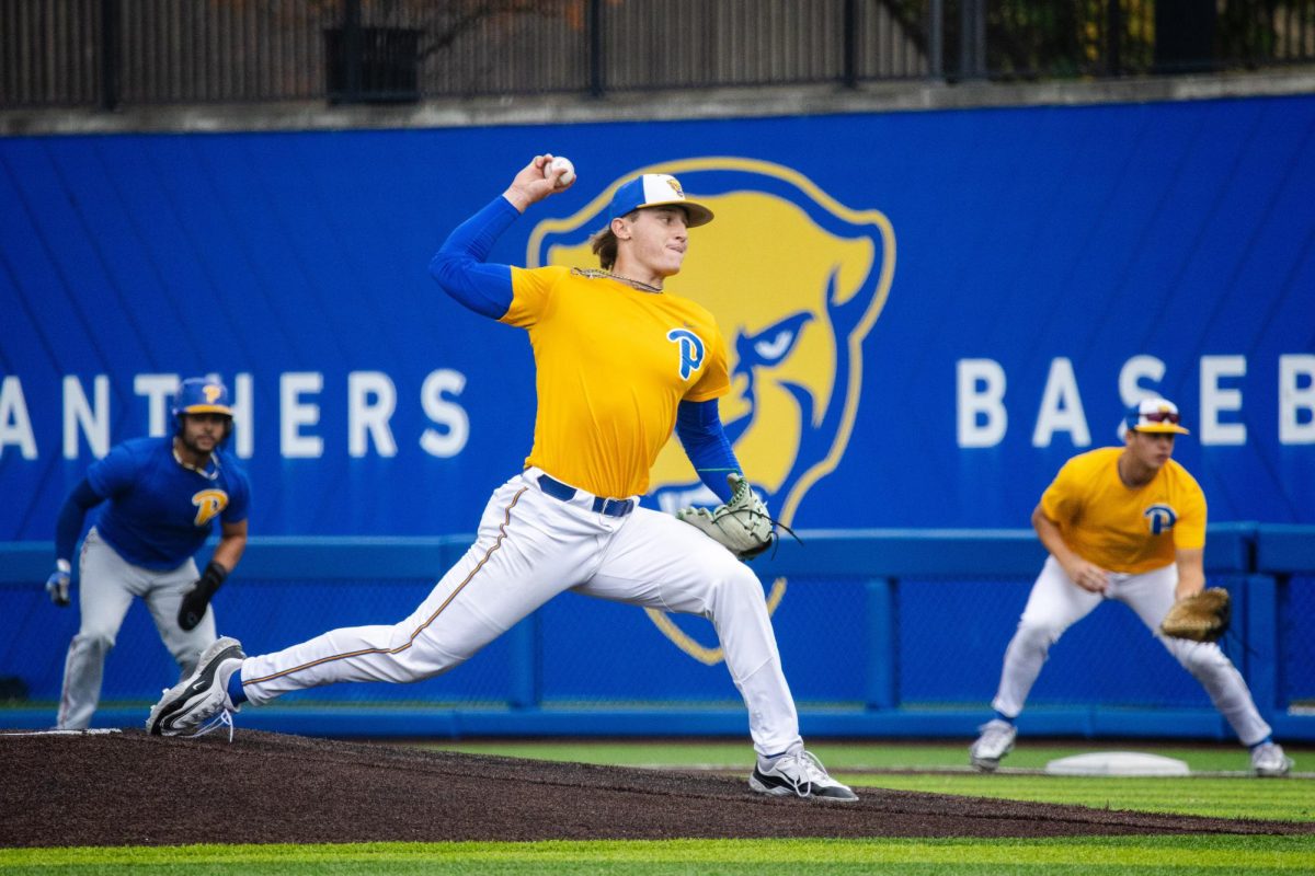 A right-handed pitcher throws the ball during the Blue/Gold Fall World Series at the Charles L. Cost Field on Oct. 27, 2023. 