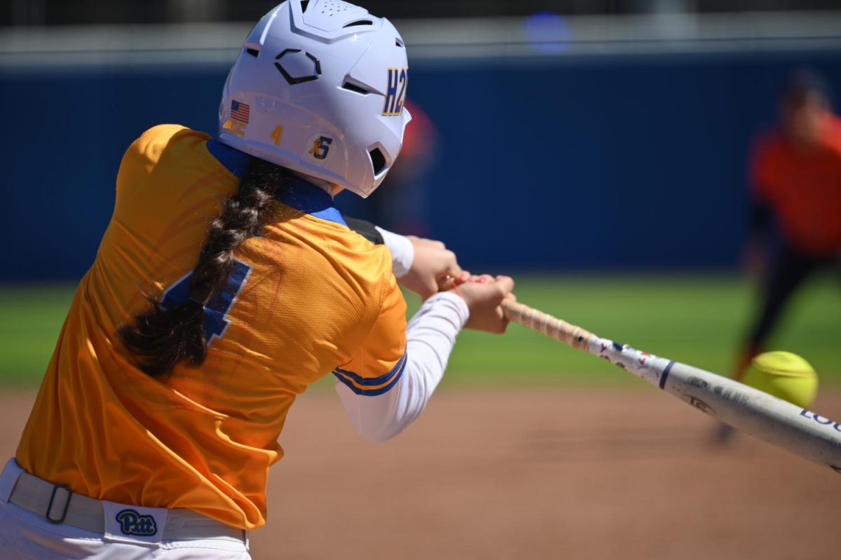 Senior Kat Rodriguez swings while up to bat during a game against UVA at Vartabedian Field on March 26, 2023. 