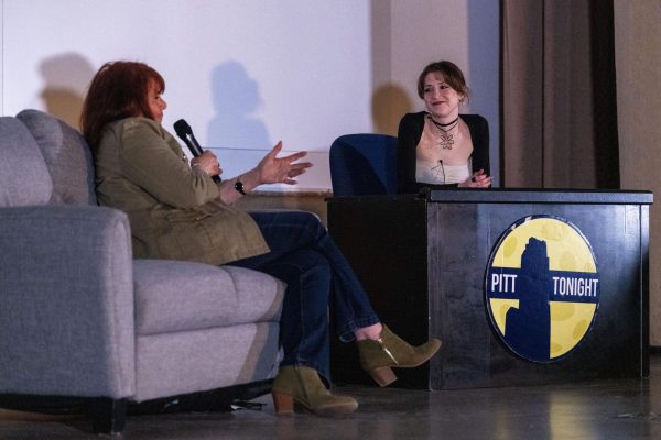 Logan Caplan (right) interviews Cindy Haines (left) during Saturday’s Pitt Tonight show in Frick Auditorium.