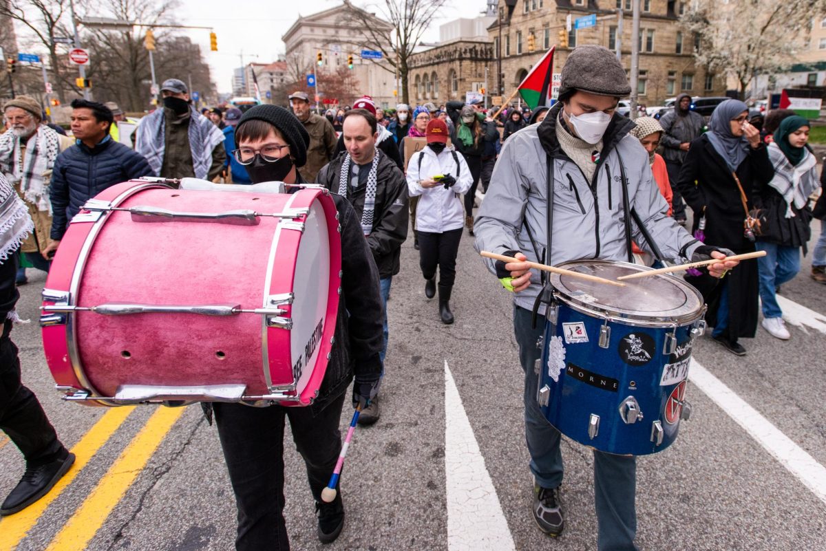 Protesters play the drums while marching during the Interfaith Gaza Ceasefire Pilgrimage on Saturday. (Alex Jurkuta | Senior Staff Photographer)