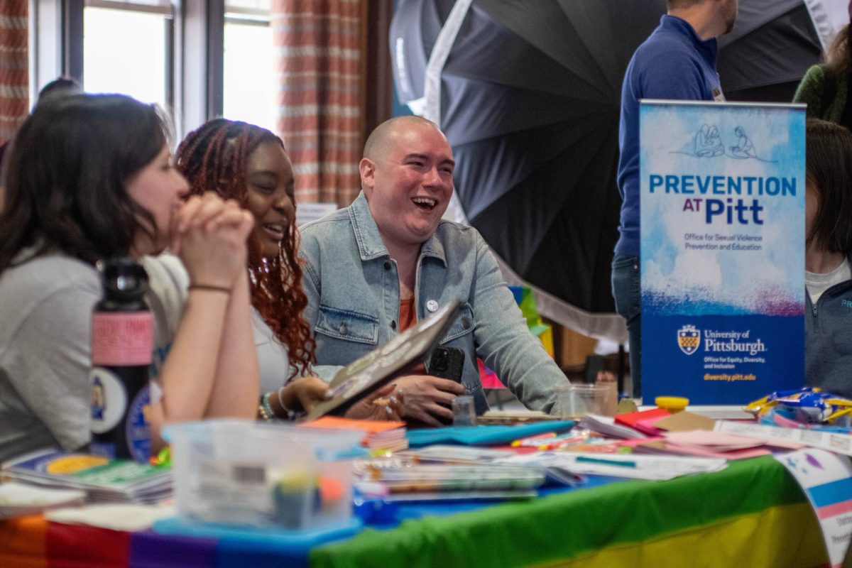 Members of Prevention at Pitt converse with attendees at the “Trans Day of Vibing” event on Friday afternoon in the OHara Student Center.