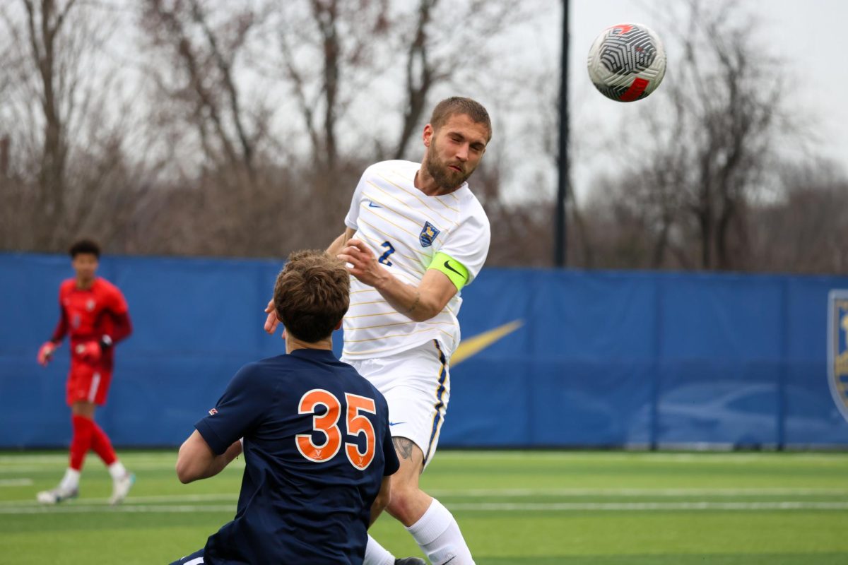 Sophomore defender Jackson Gilman (2) heads a ball during Saturday afternoon’s game against UVA at Ambrose Urbanic Field.