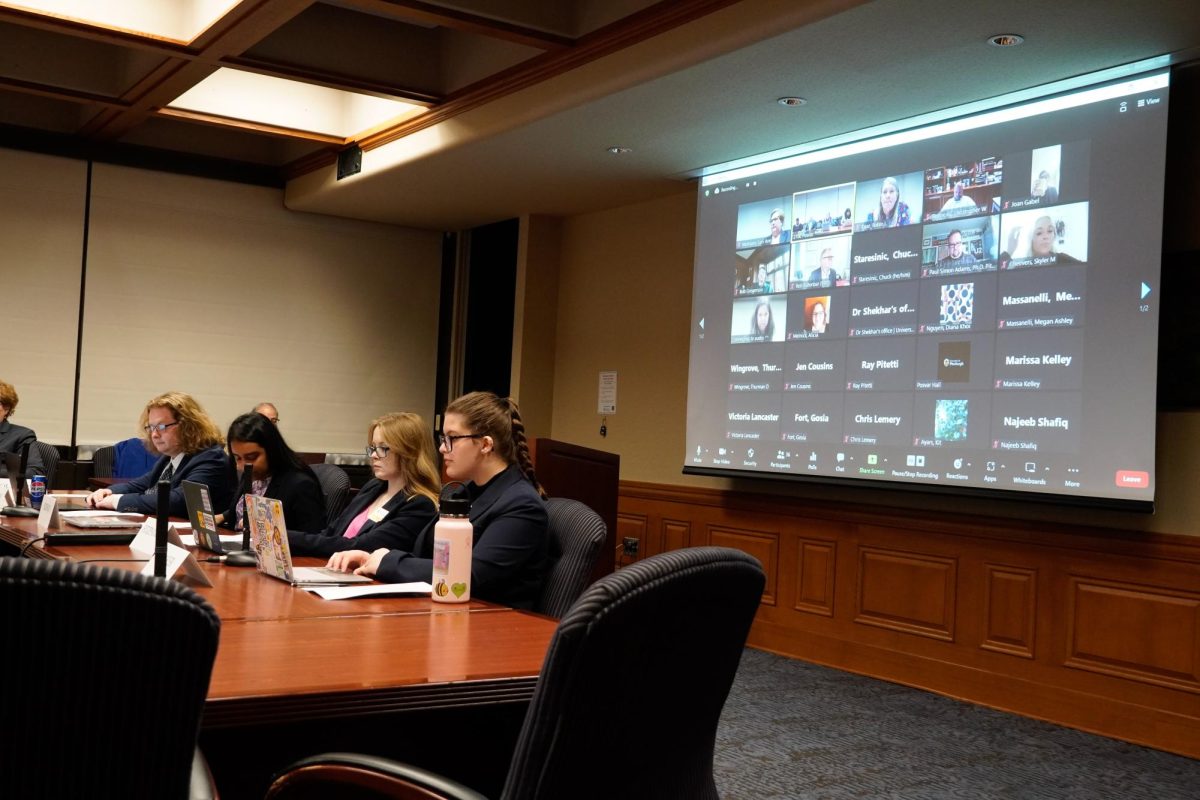(Left to right) Student Government Board President Ryan Young, Vice President of Operations Sarah Siddiqui, Vice President of Initiatives Katie Fitzpatrick and Vice President of Policy Sarah Mayer listen to the Senate Council meeting on Thursday in 2700 Posvar Hall.
