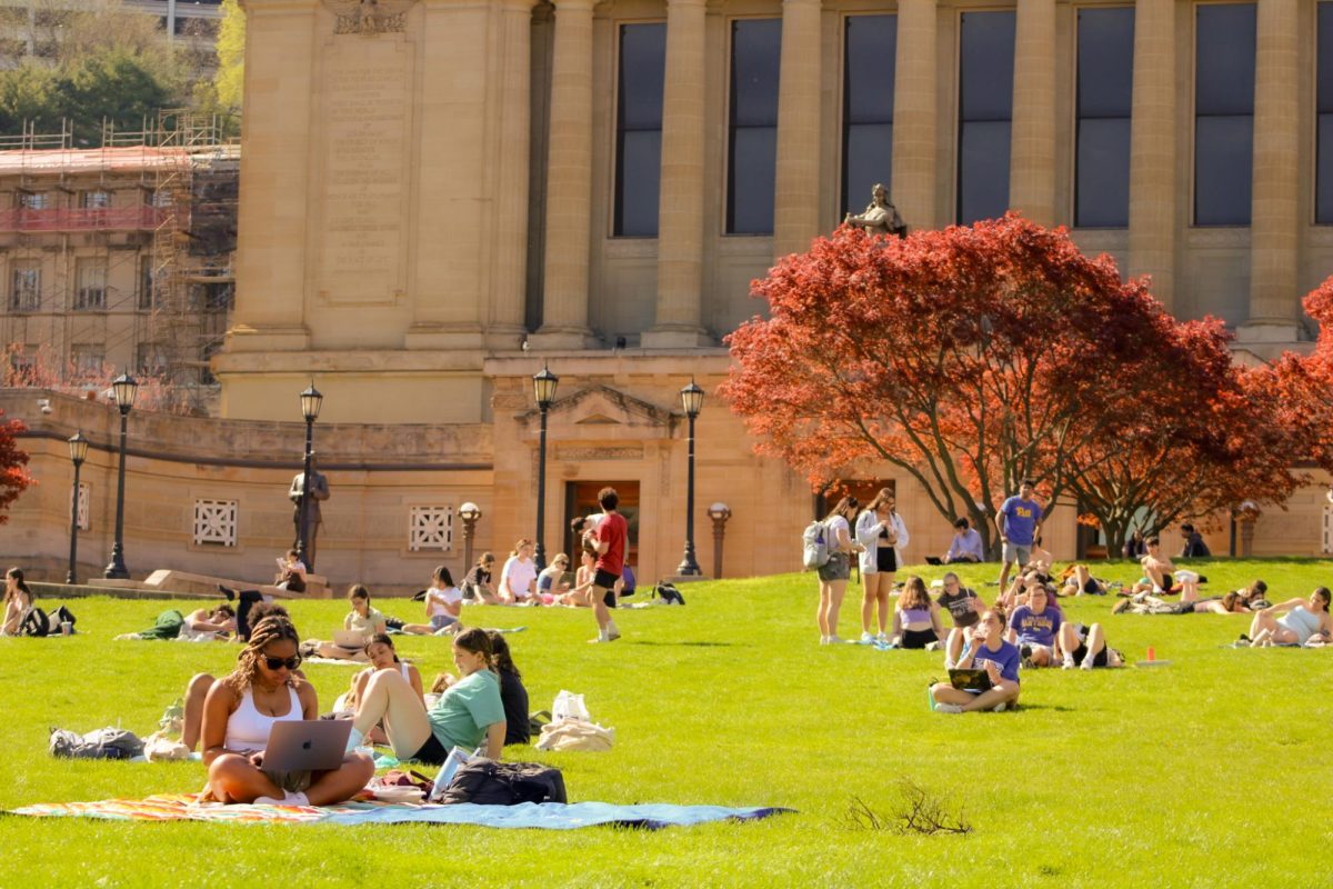 Students study outside on Soldiers and Sailors Lawn in April.