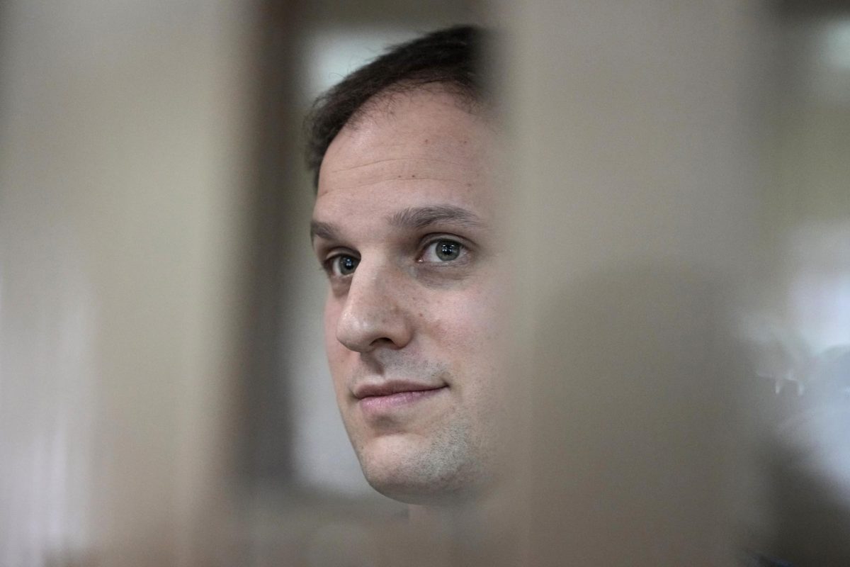 Wall Street Journal reporter Evan Gershkovich stands in a glass cage in a courtroom at the Moscow City Court in Moscow, Russia, on Oct. 10, 2023.