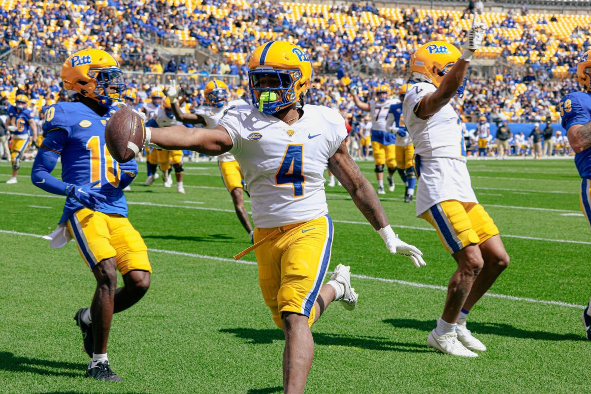 Sixth-year running back Daniel Carter (4) runs into the endzone during Pitt football’s Blue-Gold Game on Saturday afternoon at Acrisure Stadium.